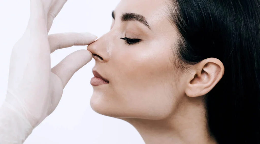 Rhinoplasty side effects including swelling, bruising, and nasal discomfort
